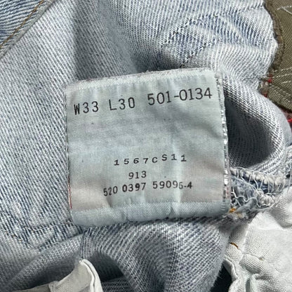 Vintage 90s Levi’s 501 button fly distressed & repaired USA made denim jeans (33x29)