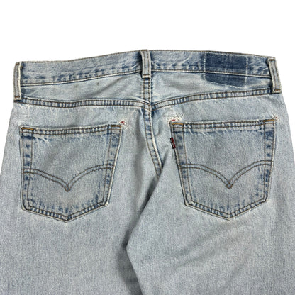 Vintage 90s Levi’s 501 button fly distressed & repaired USA made denim jeans (33x29)