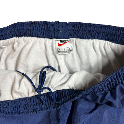 Vintage 90s Nike mini swoosh navy track pants (L)